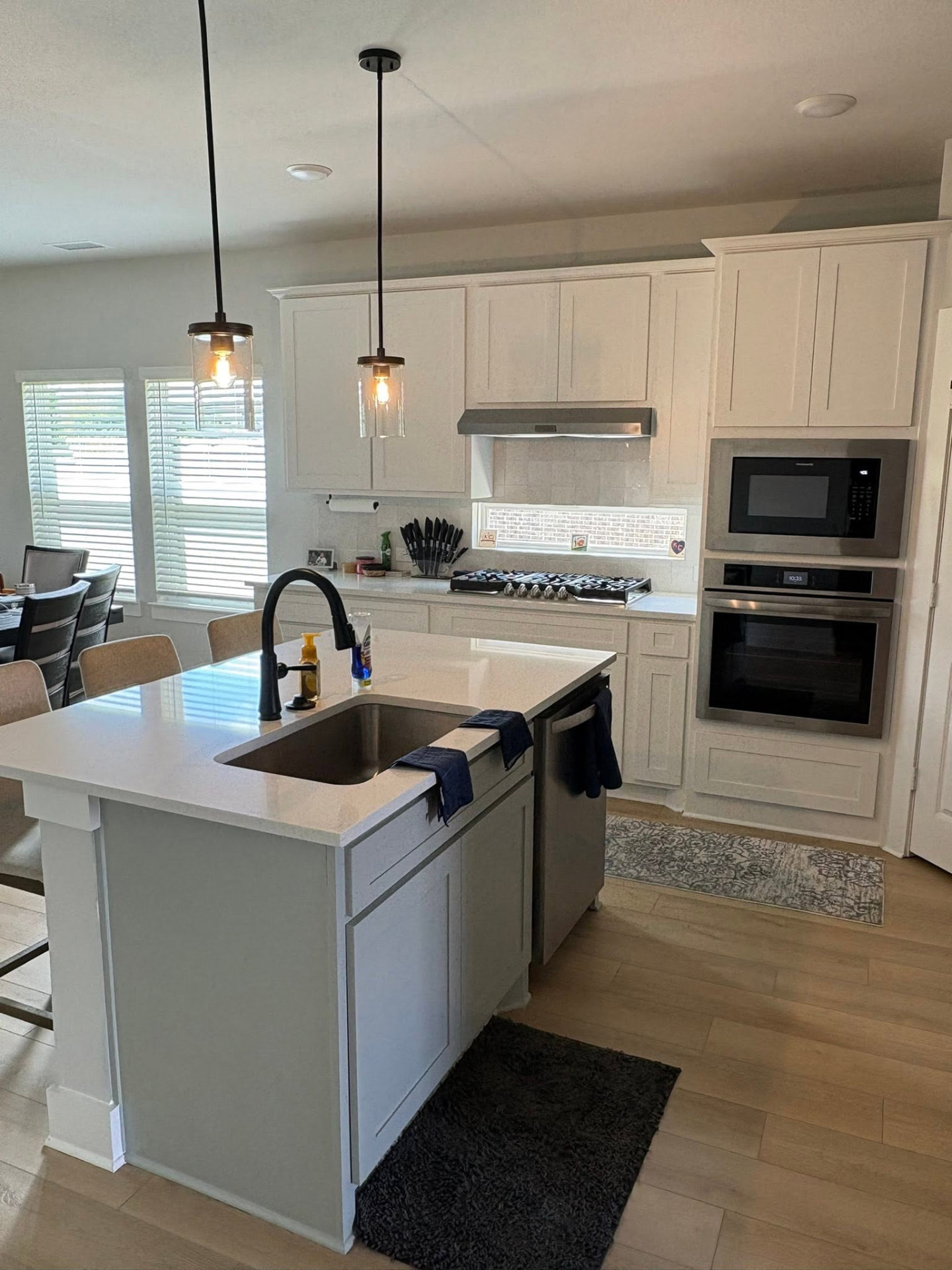 Freshly cleaned kitchen with a large island in a Phoenix-area home